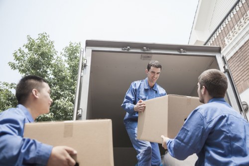 Local removals team loading furniture near Shadwell flats