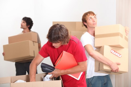 Packed household boxes and furniture prepared for local removals in Shadwell