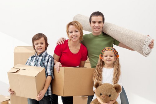 Packed boxes and furniture prepared for loading during a Shadwell removal