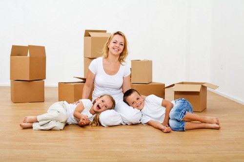 Movers carrying furniture through a residential property